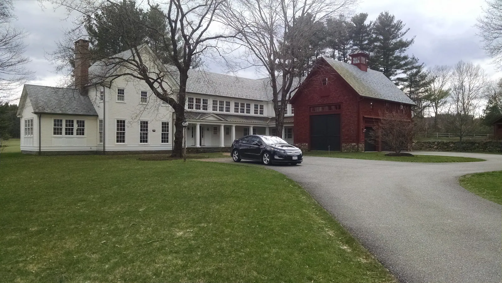White farmhouse with a red barn painted by Beacon