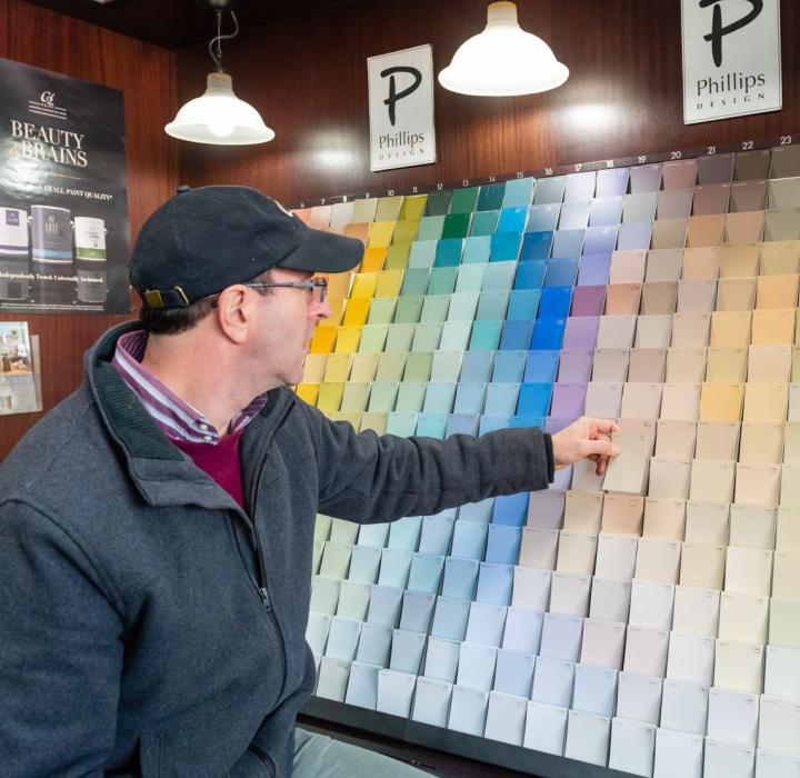 beacon painting founder looking at color chart